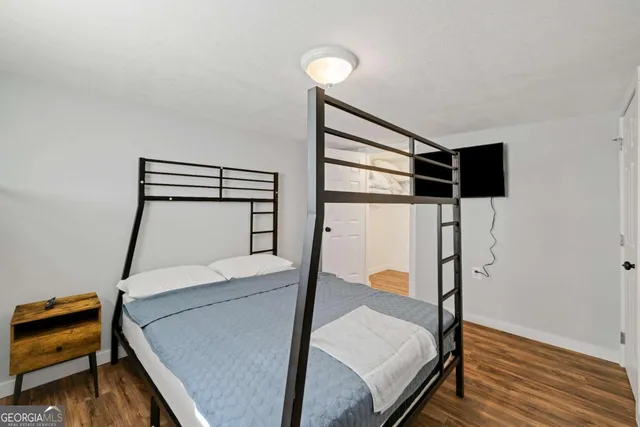 a room with stairs and wooden floor