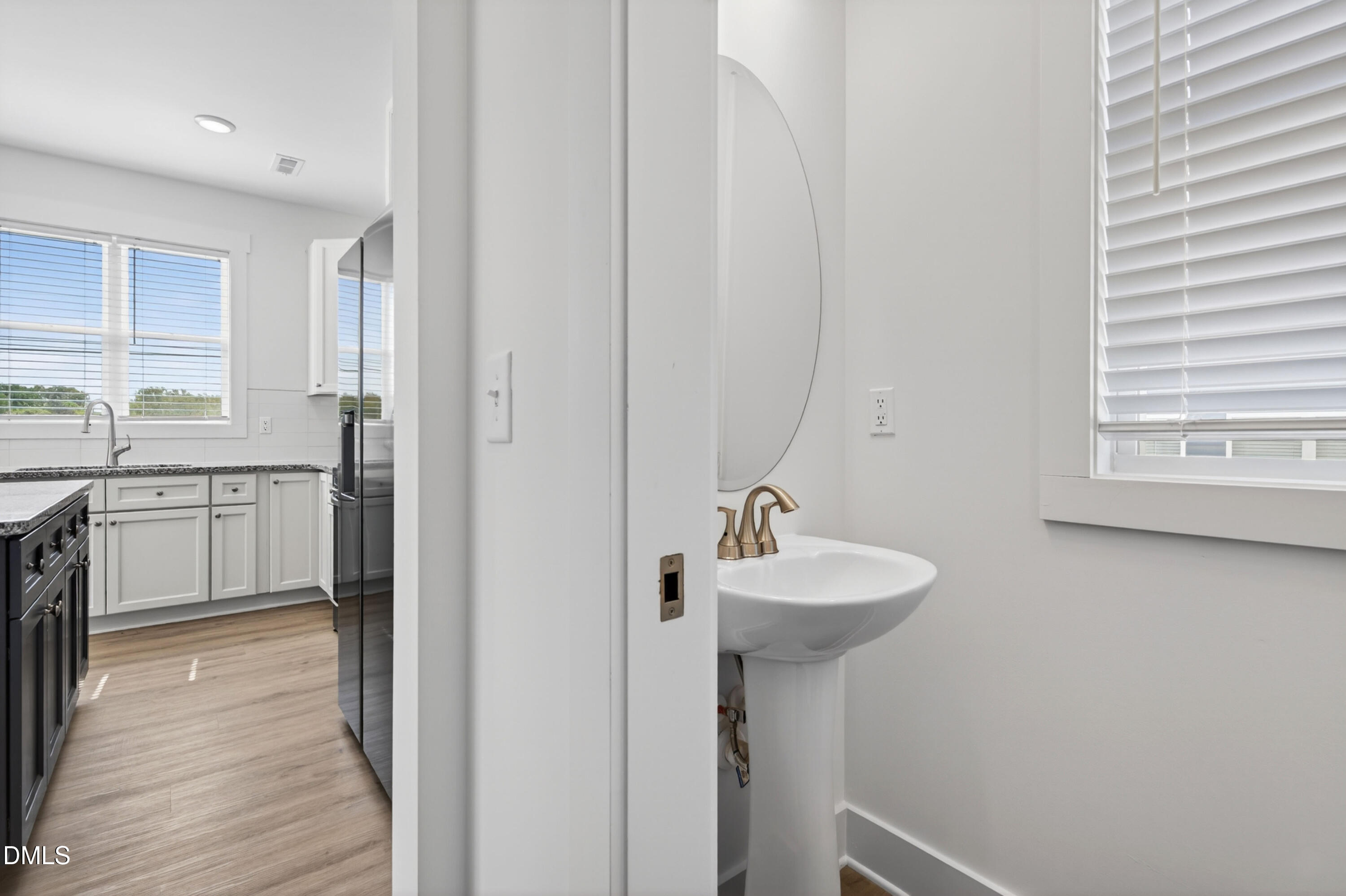 1238 Hurdle Mills Road Roxboro, NC 27573 - Photo 23 of 50 a bathroom with a sink a mirror and a window