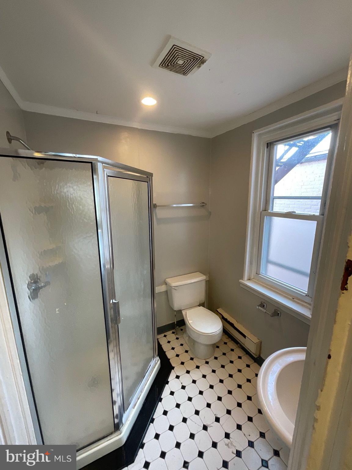 815 Weiser Street Reading, PA 19601 - Photo 13 of 19 a bathroom with a sink toilet and shower