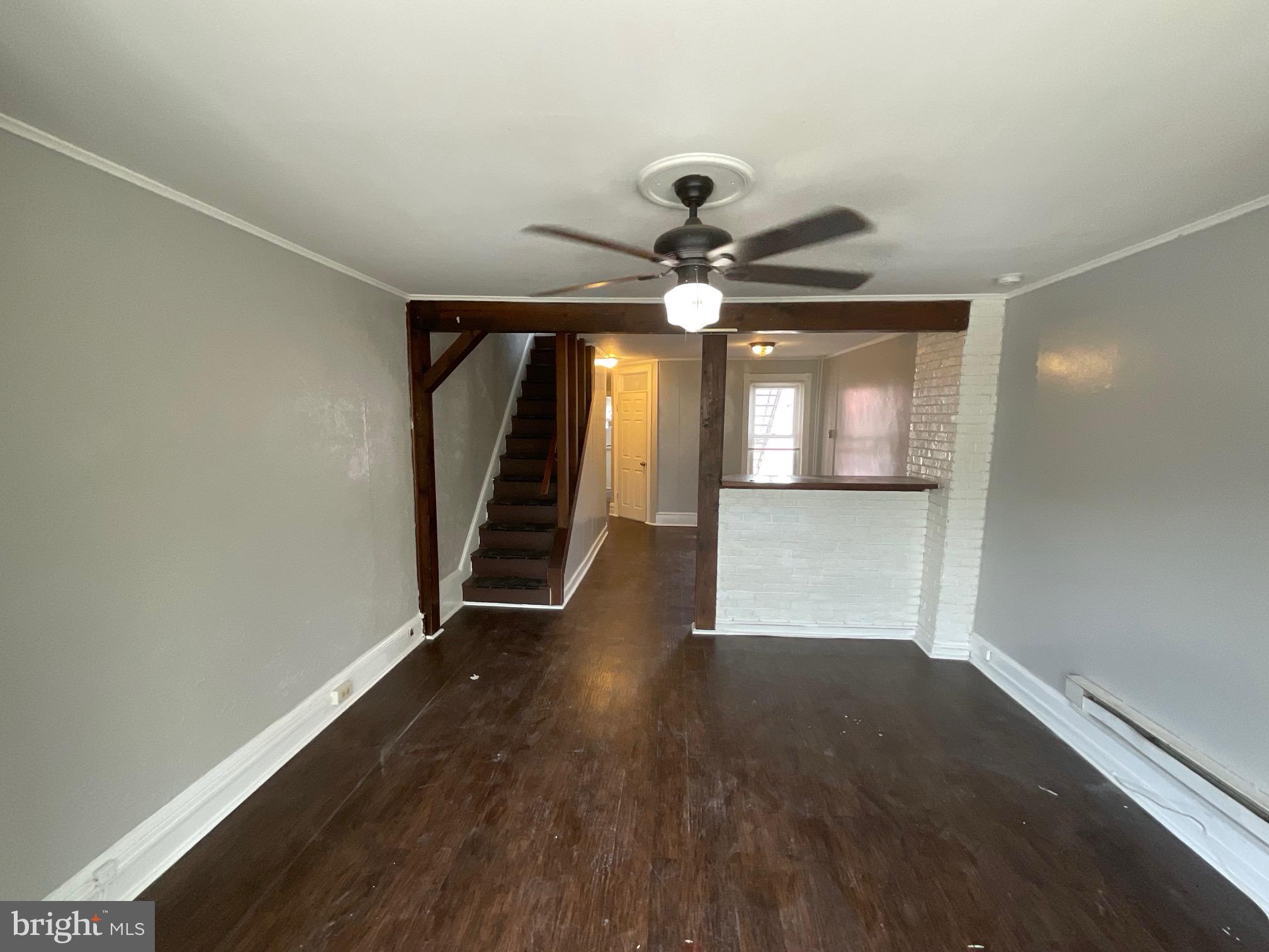 815 Weiser Street Reading, PA 19601 - Photo 9 of 19 an empty room with wooden floor and windows