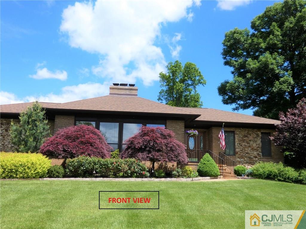 25 Runnymede Road Colonia, NJ 07067 - Photo 1 of 26 a front view of house with yard and green space