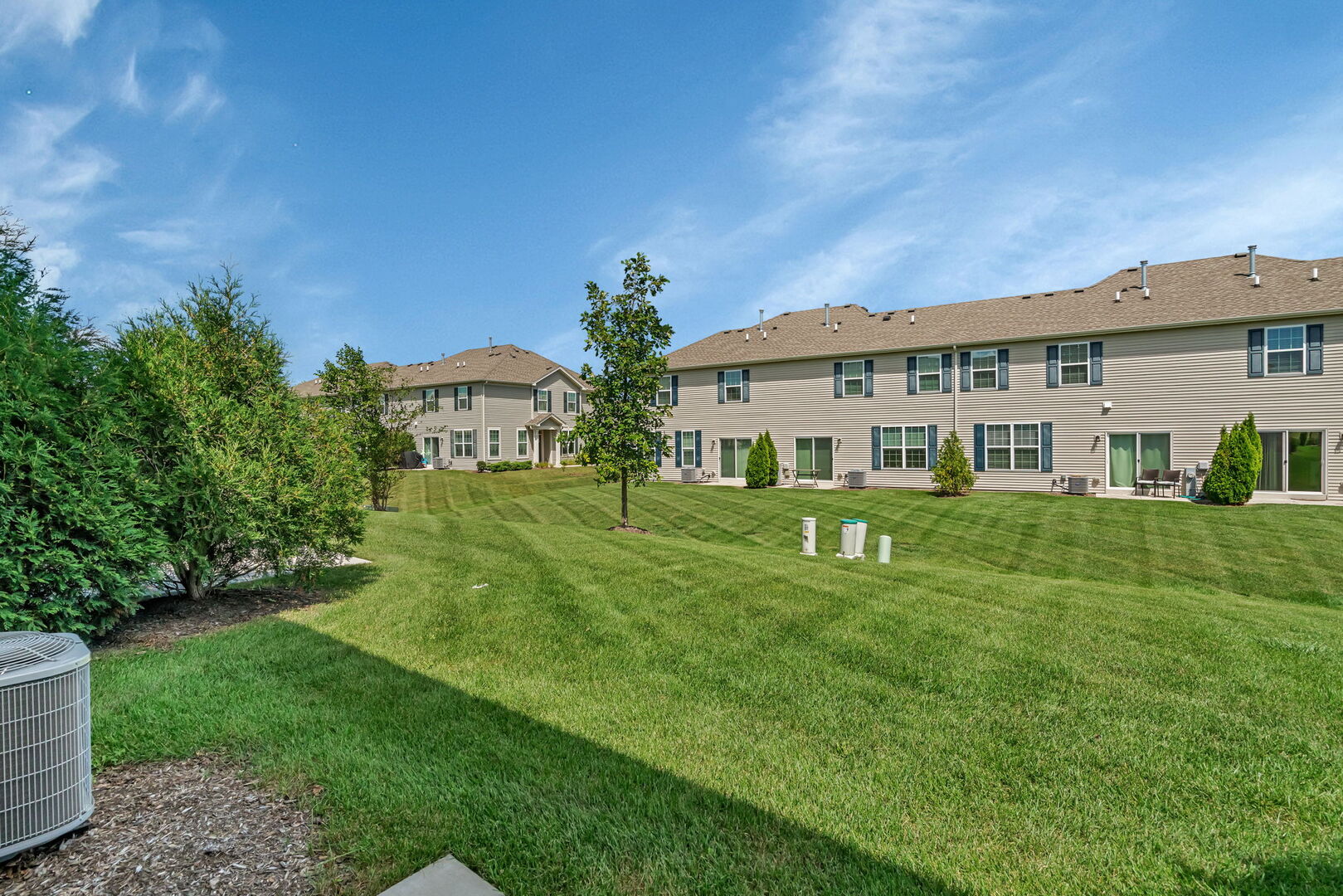 1334 Hawk Hollow Drive Yorkville, IL 60560 - Photo 22 of 28 a view of a house with a big yard and potted plants