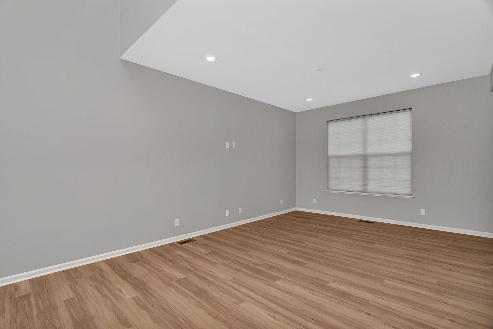 1334 Hawk Hollow Drive Yorkville, IL 60560 - Photo 4 of 28 a view of an empty room with wooden floor and a window