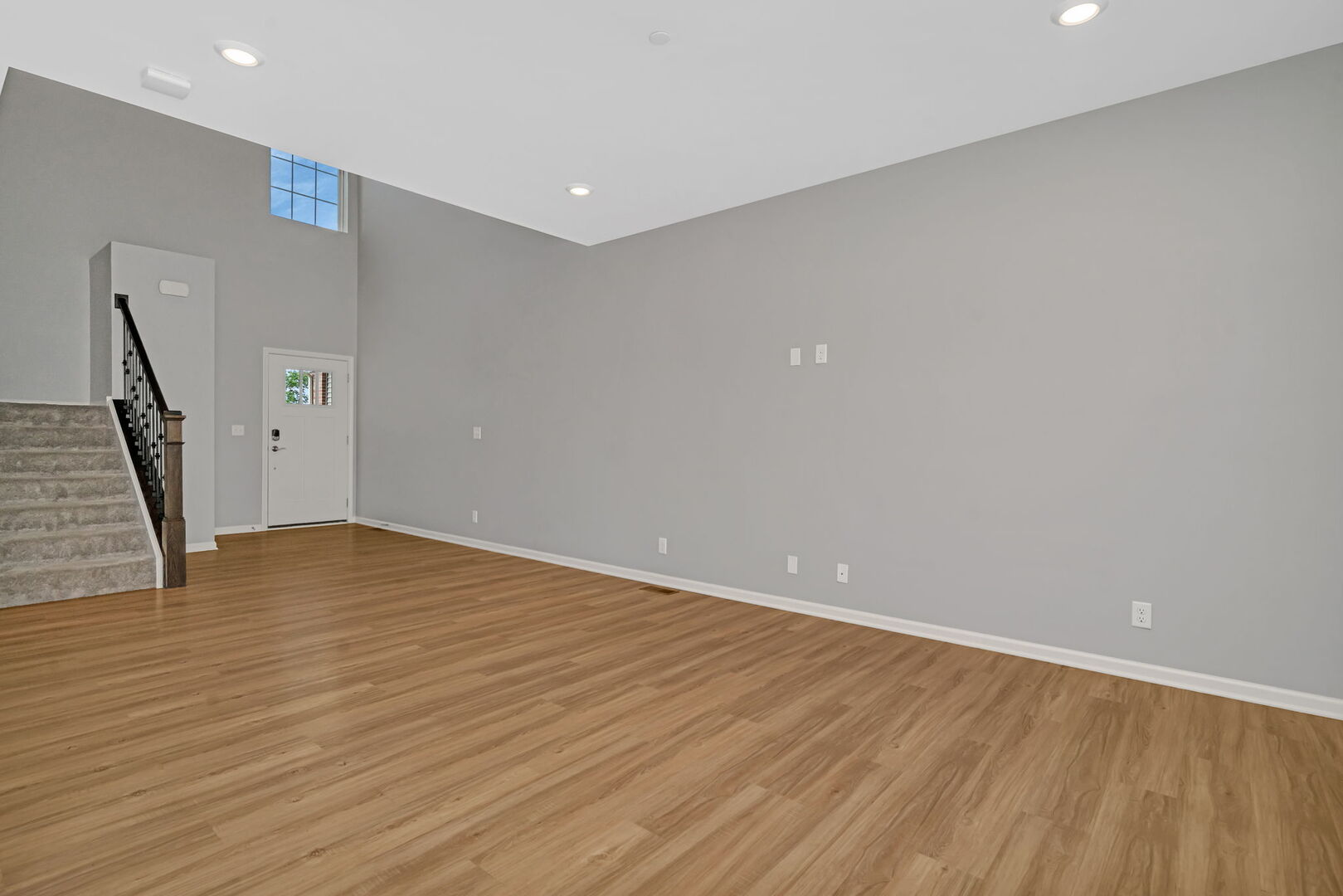 1334 Hawk Hollow Drive Yorkville, IL 60560 - Photo 6 of 28 a view of an empty room with wooden floor and stairs