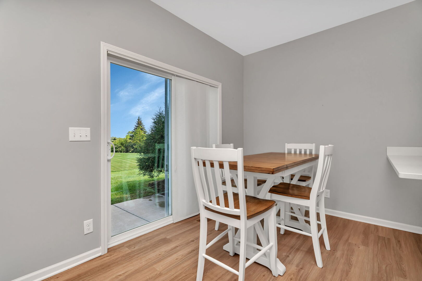 1334 Hawk Hollow Drive Yorkville, IL 60560 - Photo 7 of 28 a view of a dining room with furniture and wooden floor