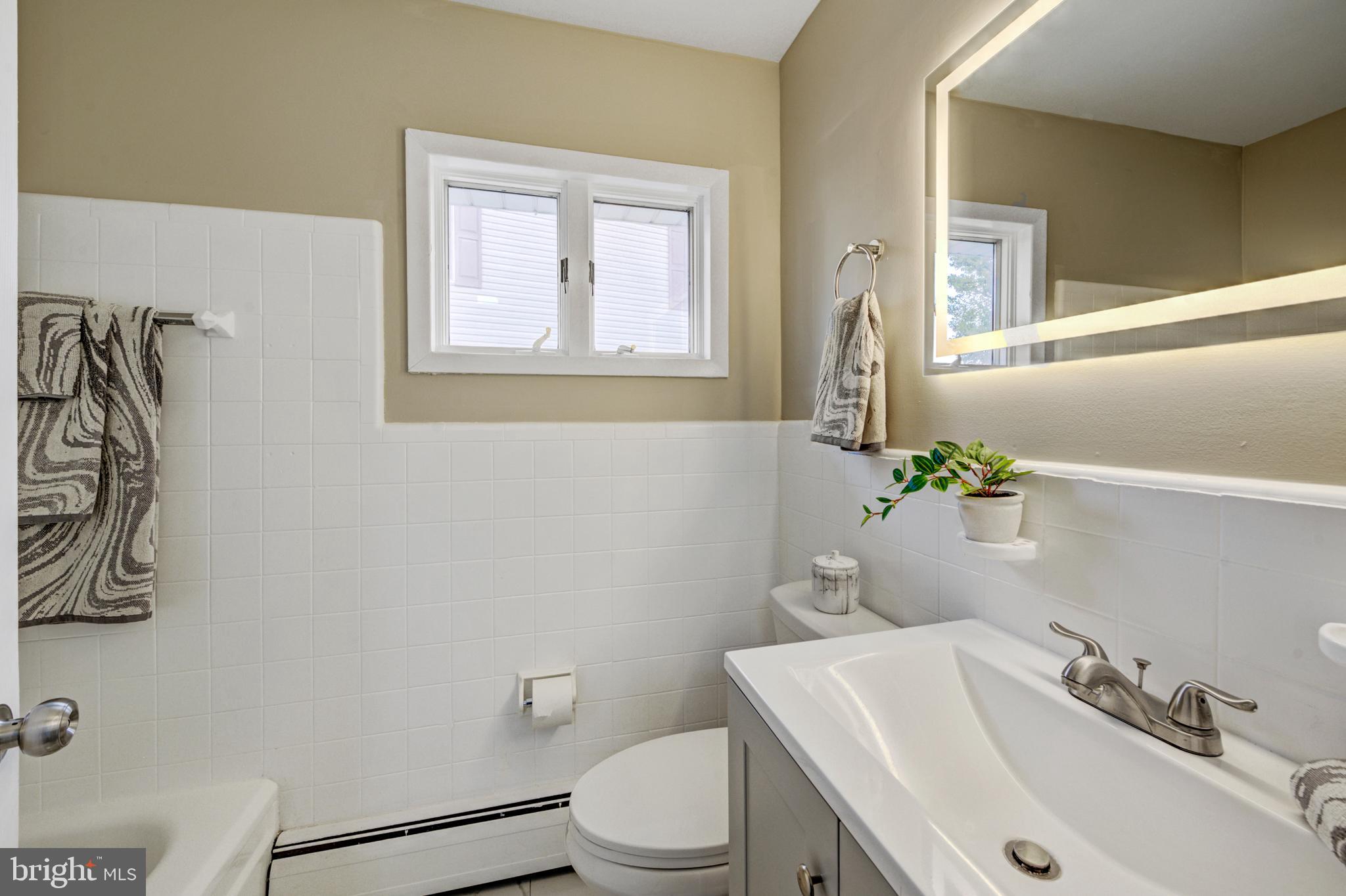 4255 Somerton Road Feasterville-Trevose, PA 19053 - Photo 16 of 37 a bathroom with a sink mirror and toilet