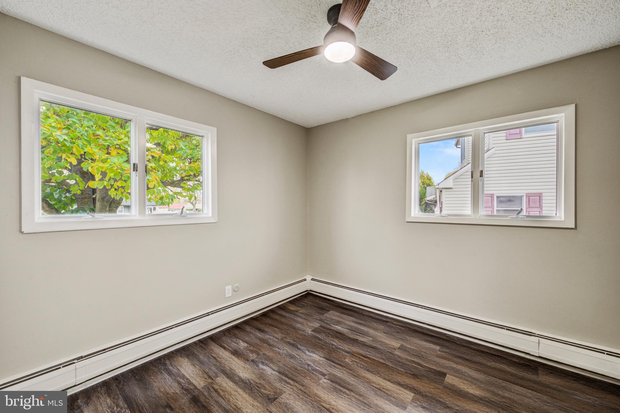 4255 Somerton Road Feasterville-Trevose, PA 19053 - Photo 22 of 37 a view of empty room with window and ceiling fan
