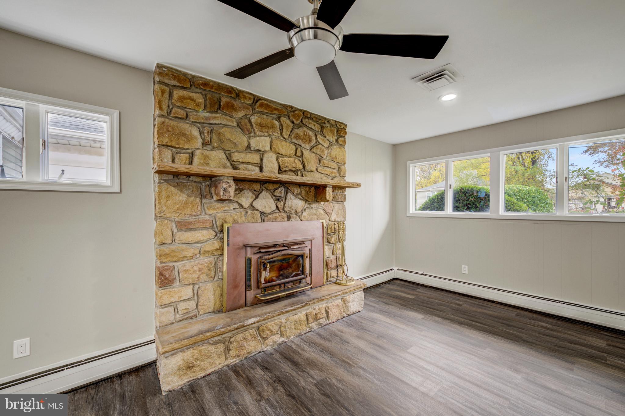 4255 Somerton Road Feasterville-Trevose, PA 19053 - Photo 24 of 37 wooden floor fireplace and windows in an empty room