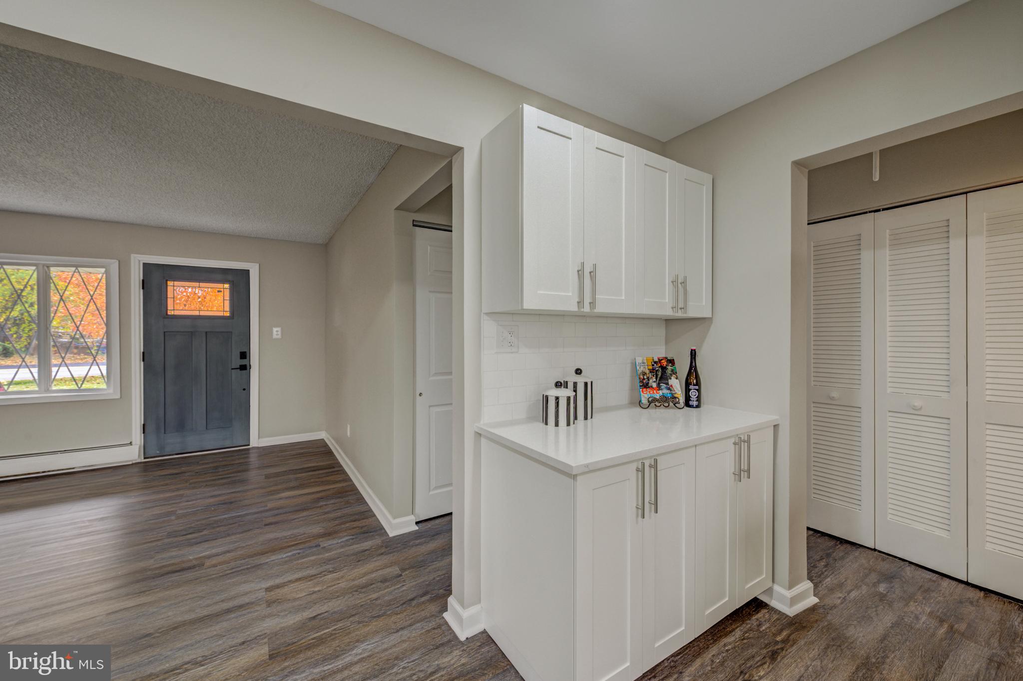 4255 Somerton Road Feasterville-Trevose, PA 19053 - Photo 5 of 37 a view of a kitchen with closet and wooden floor