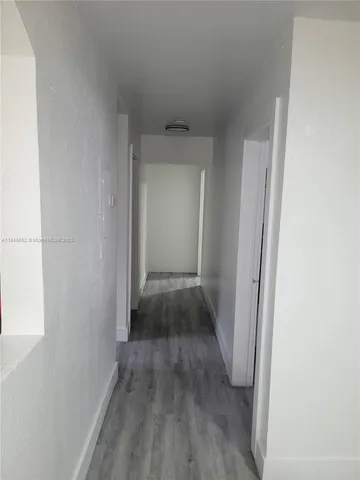 a view of cabinets and wooden floor