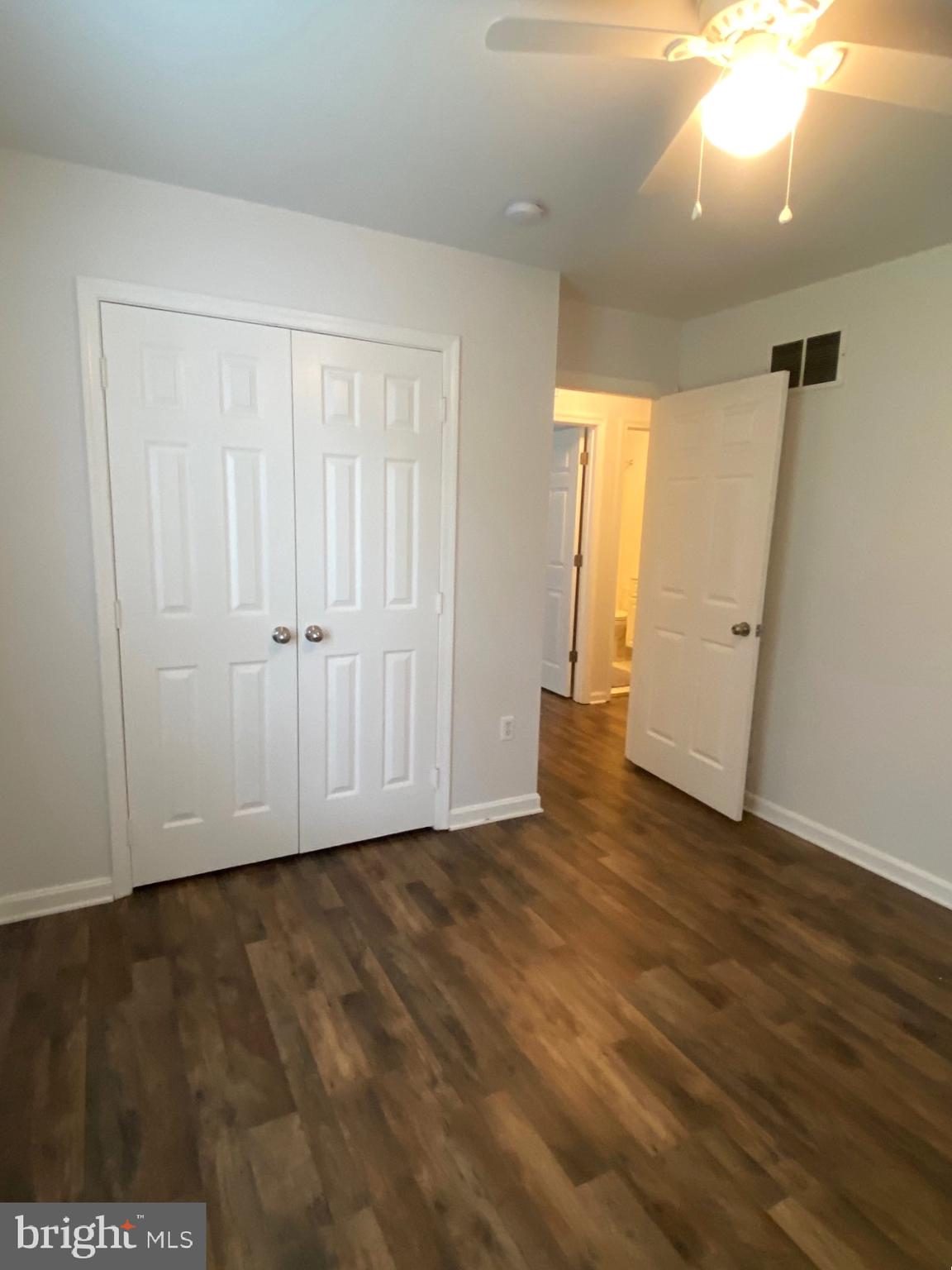 4 Wolf Avenue Reisterstown, MD 21136 - Photo 13 of 39 an empty room with wooden floor and white walls