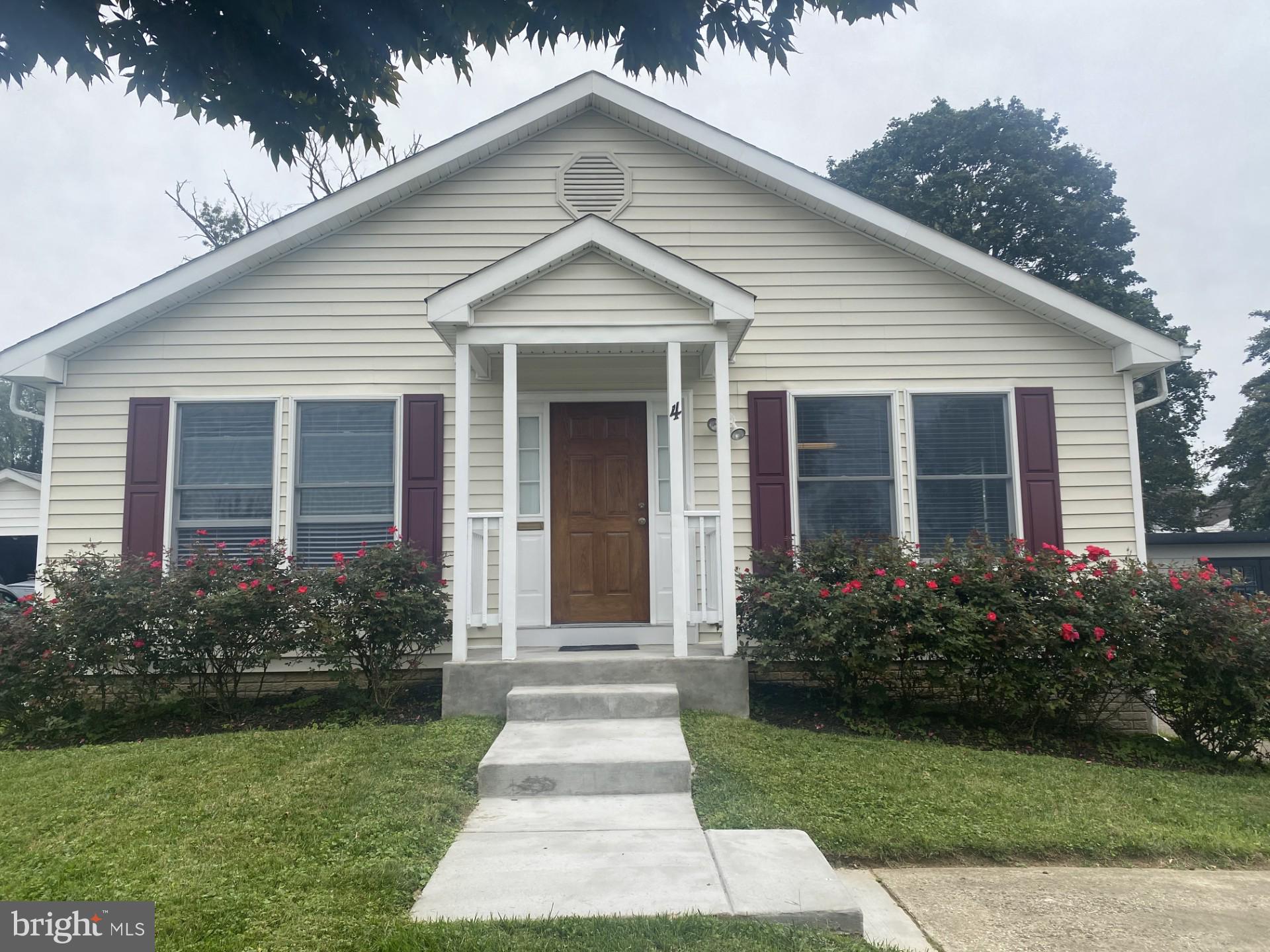 4 Wolf Avenue Reisterstown, MD 21136 - Photo 3 of 39 a front view of a house with garden