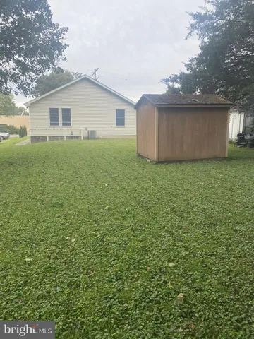 a house view with a backyard space
