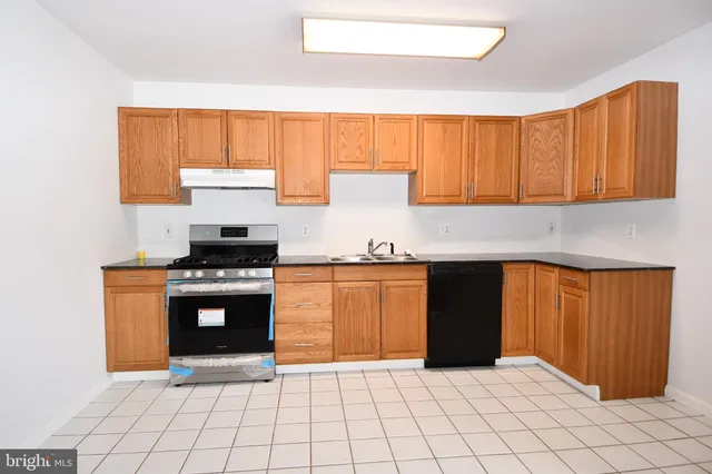 a view of a dining room with furniture wooden floor and chandelier