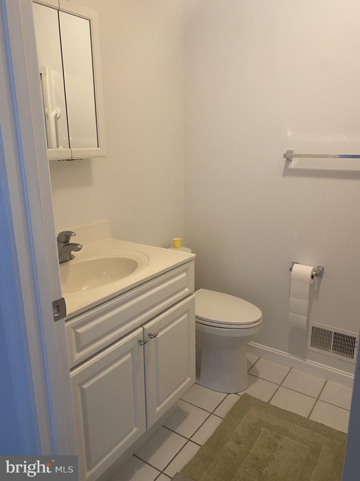 4 Wolf Avenue Reisterstown, MD 21136 - Photo 10 of 39 a bathroom with a sink a toilet and a mirror