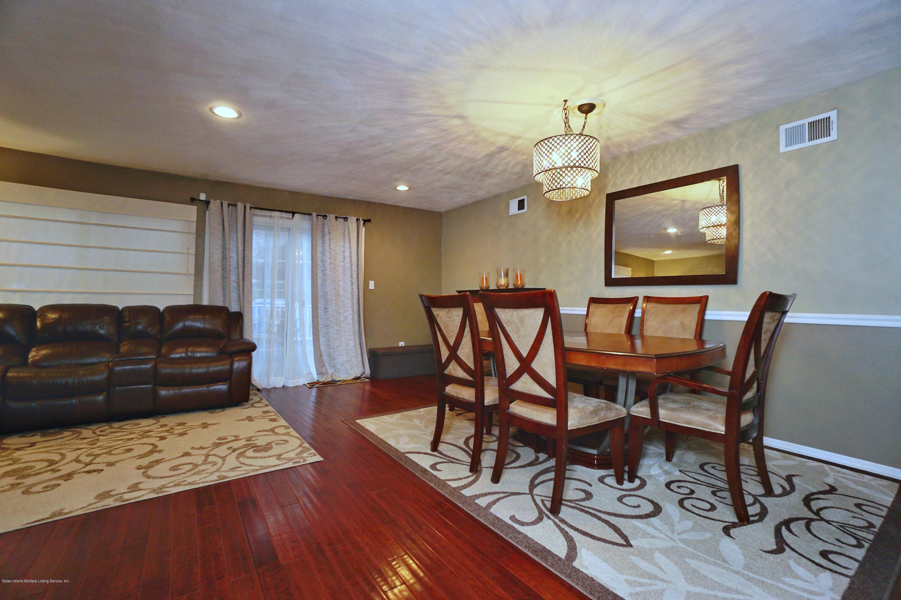 43 Forest Green Staten Island, NY 10312 - Photo 13 of 30 a living room with furniture and a wooden floor