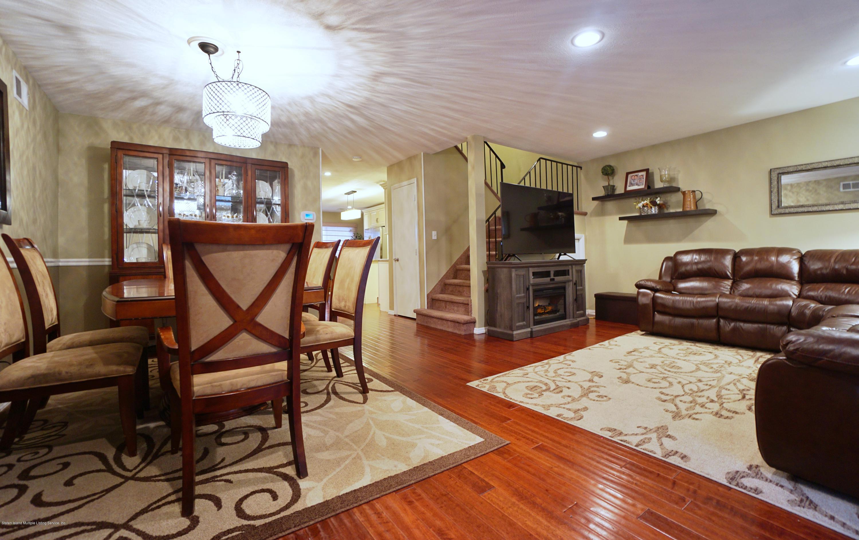 43 Forest Green Staten Island, NY 10312 - Photo 14 of 30 a living room with furniture and a wooden floor