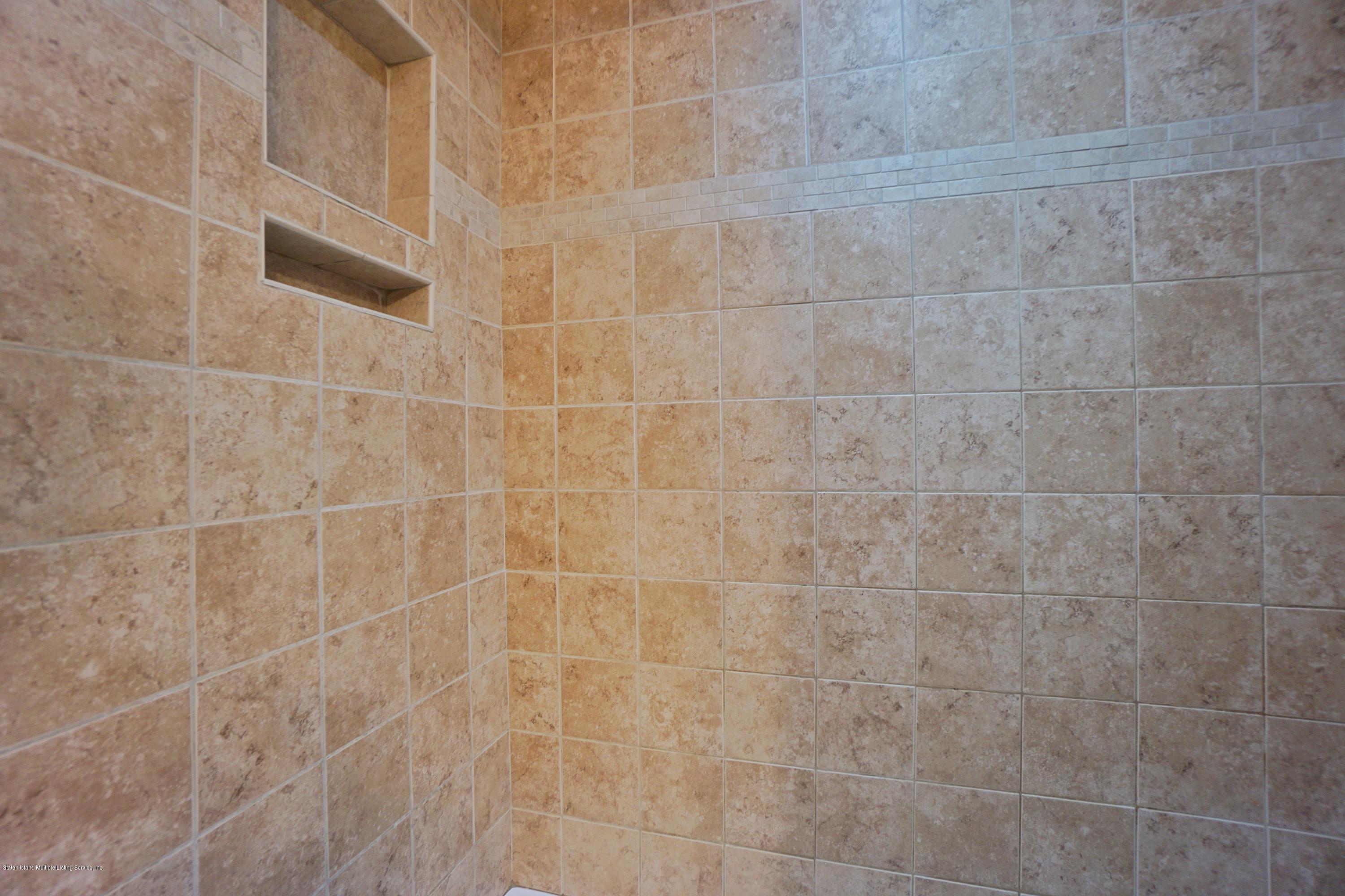 43 Forest Green Staten Island, NY 10312 - Photo 22 of 30 a bathroom with a shower
