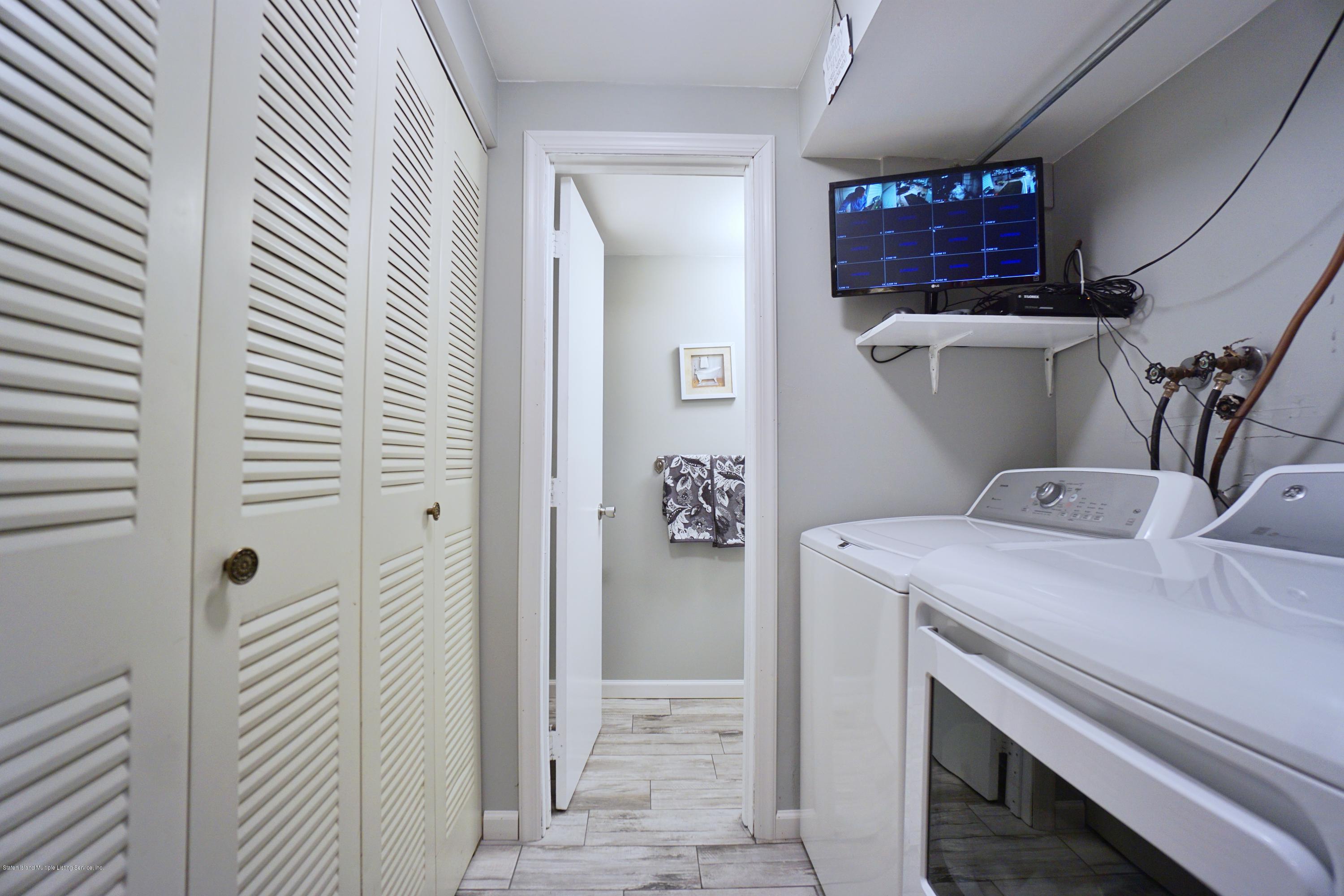 43 Forest Green Staten Island, NY 10312 - Photo 9 of 30 a utility room with dryer and washer