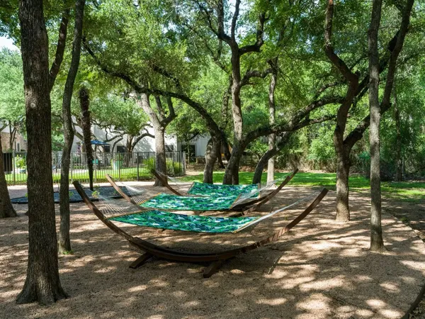 a view of a backyard with table and chairs