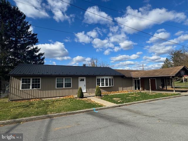 300 Locust Street Burnham, PA 17009 - Photo 2 of 35 a front view of a house with a garden
