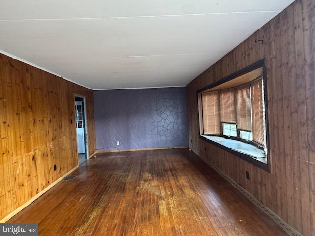 300 Locust Street Burnham, PA 17009 - Photo 5 of 35 a view of an empty room with wooden floor and a window