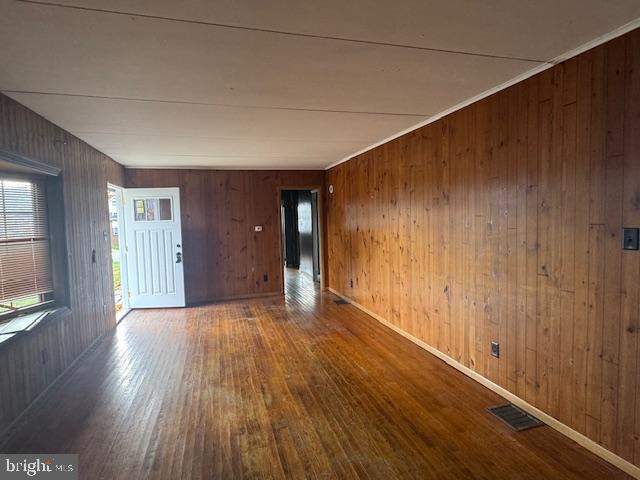 300 Locust Street Burnham, PA 17009 - Photo 6 of 35 a view of an empty room with wooden floor and a window