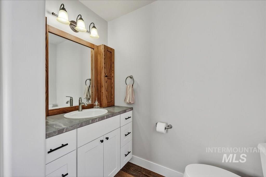 2651 Fruitvale Glendale Road Council, ID 83612 - Photo 11 of 25 Bathroom with vanity and dark wood finished floors