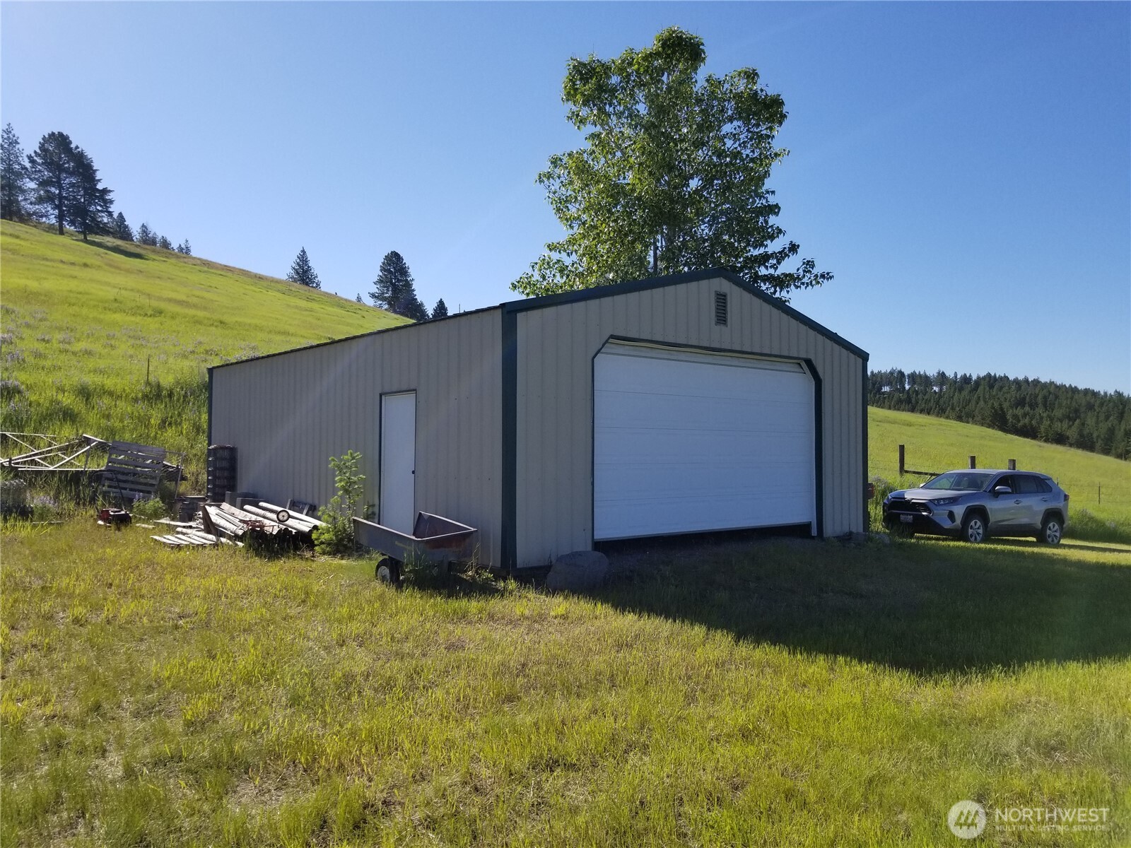49 Old Ranch House Road Republic, WA 99166 - Photo 2 of 13 a view of a house with backyard and sitting area