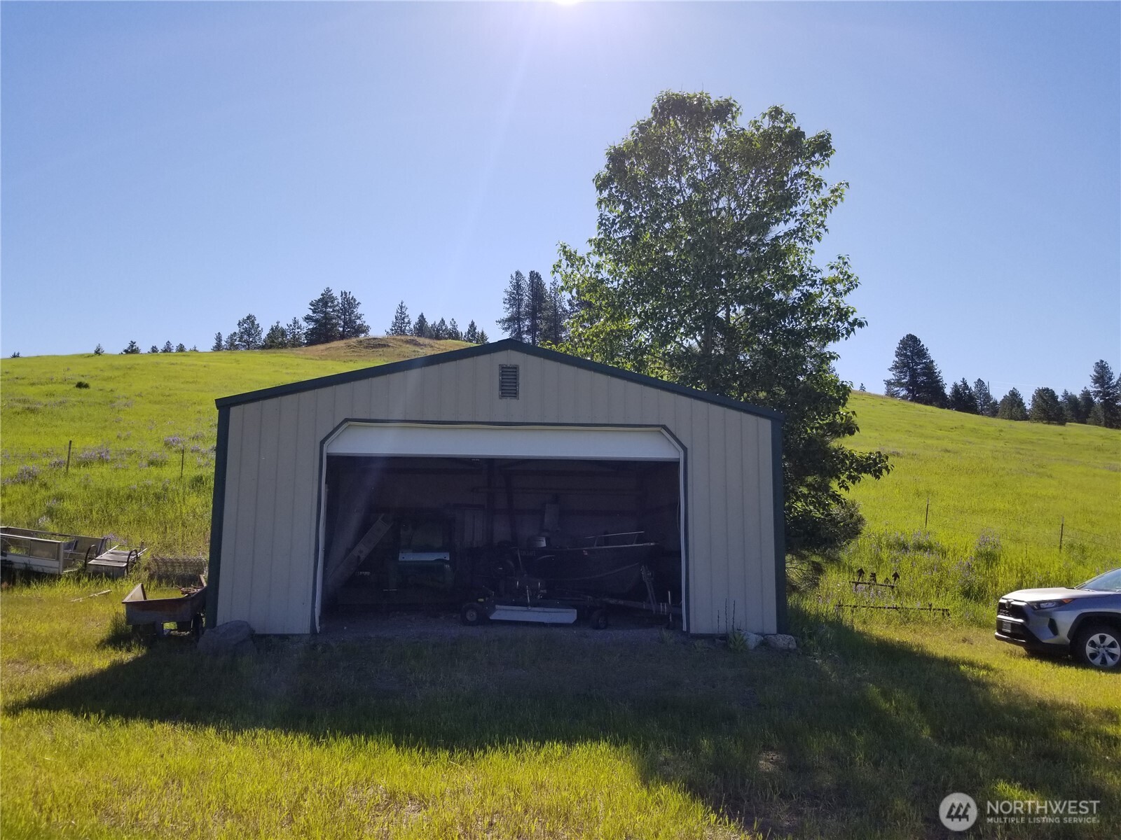 49 Old Ranch House Road Republic, WA 99166 - Photo 3 of 13 a front view of a house with a yard
