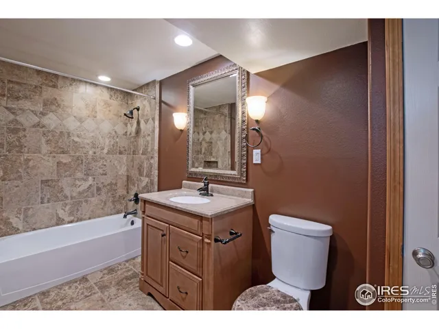 a view of a house with brick walls and a yard