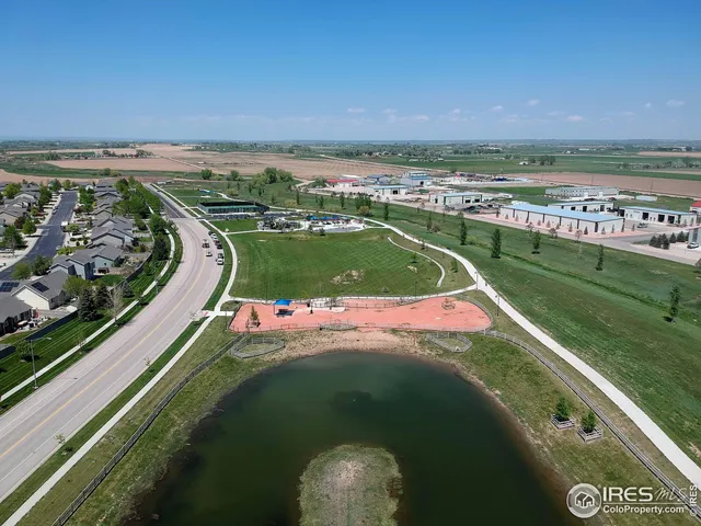 a view of a lake with a large barn