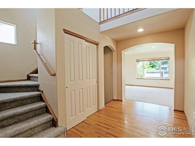 a view of an entryway with wooden floor