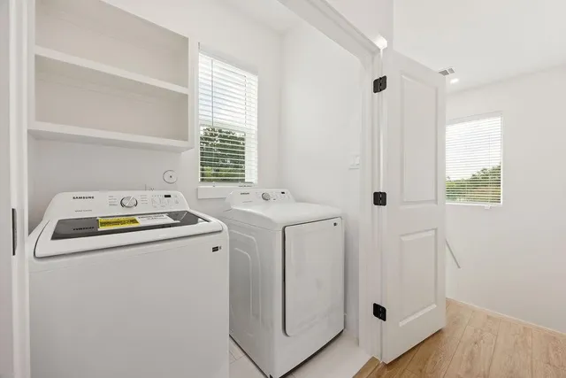 a utility room with dryer and washer