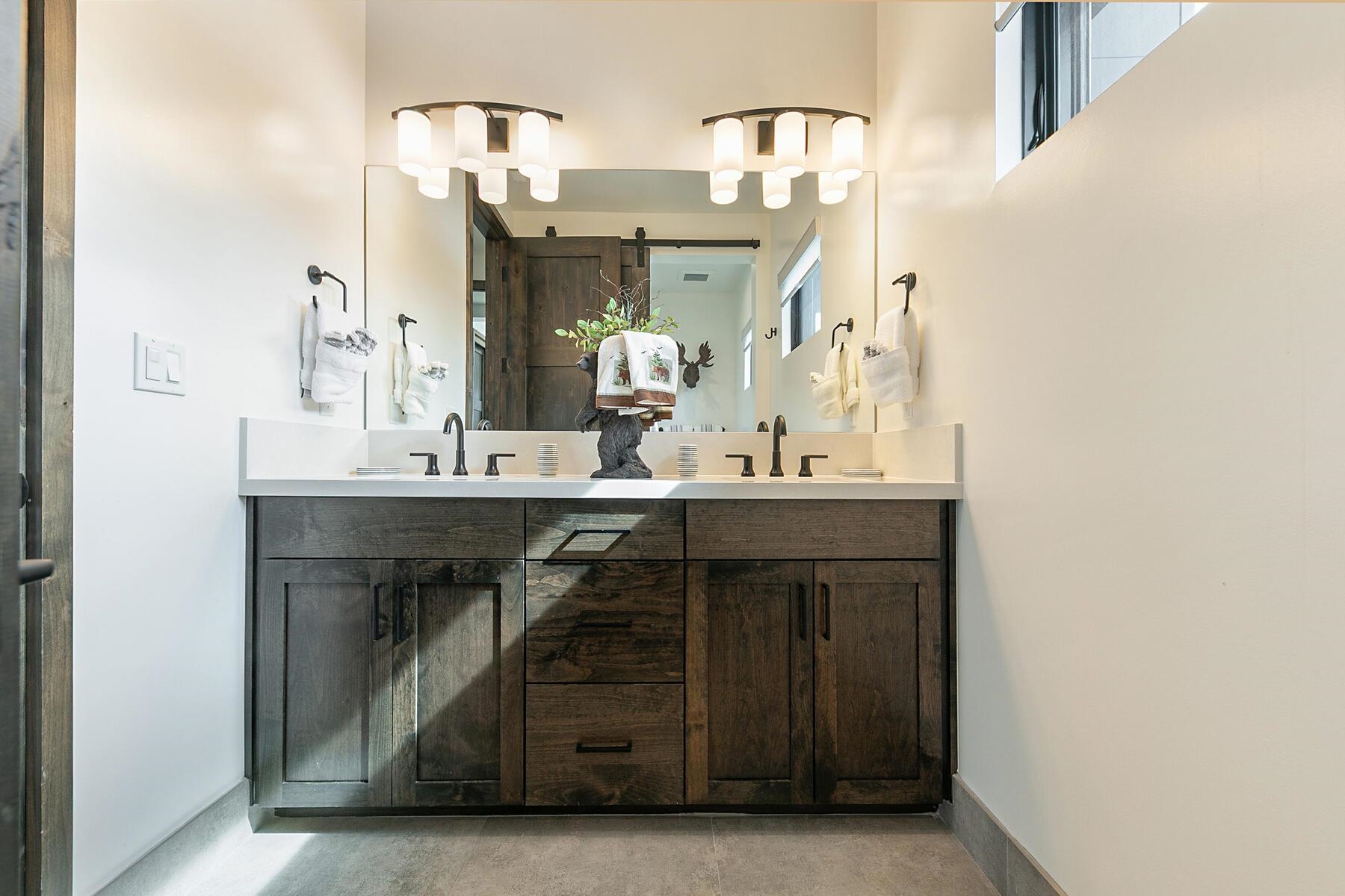 10209 Modane Place Truckee, CA 96161 - Photo 20 of 26 a bathroom with a sink and a mirror