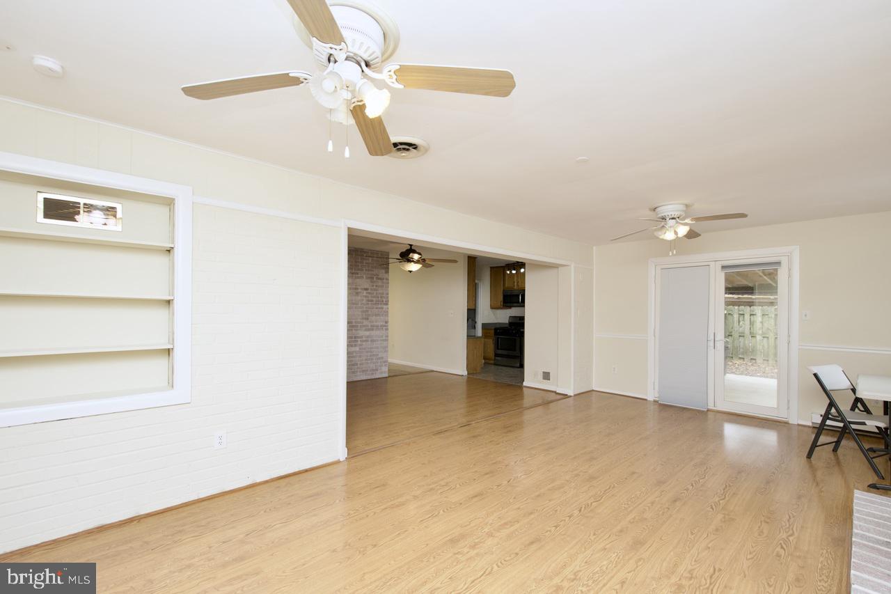 5509 Glenallen Street Springfield, VA 22151 - Photo 13 of 36 wooden floor in an empty room with a window