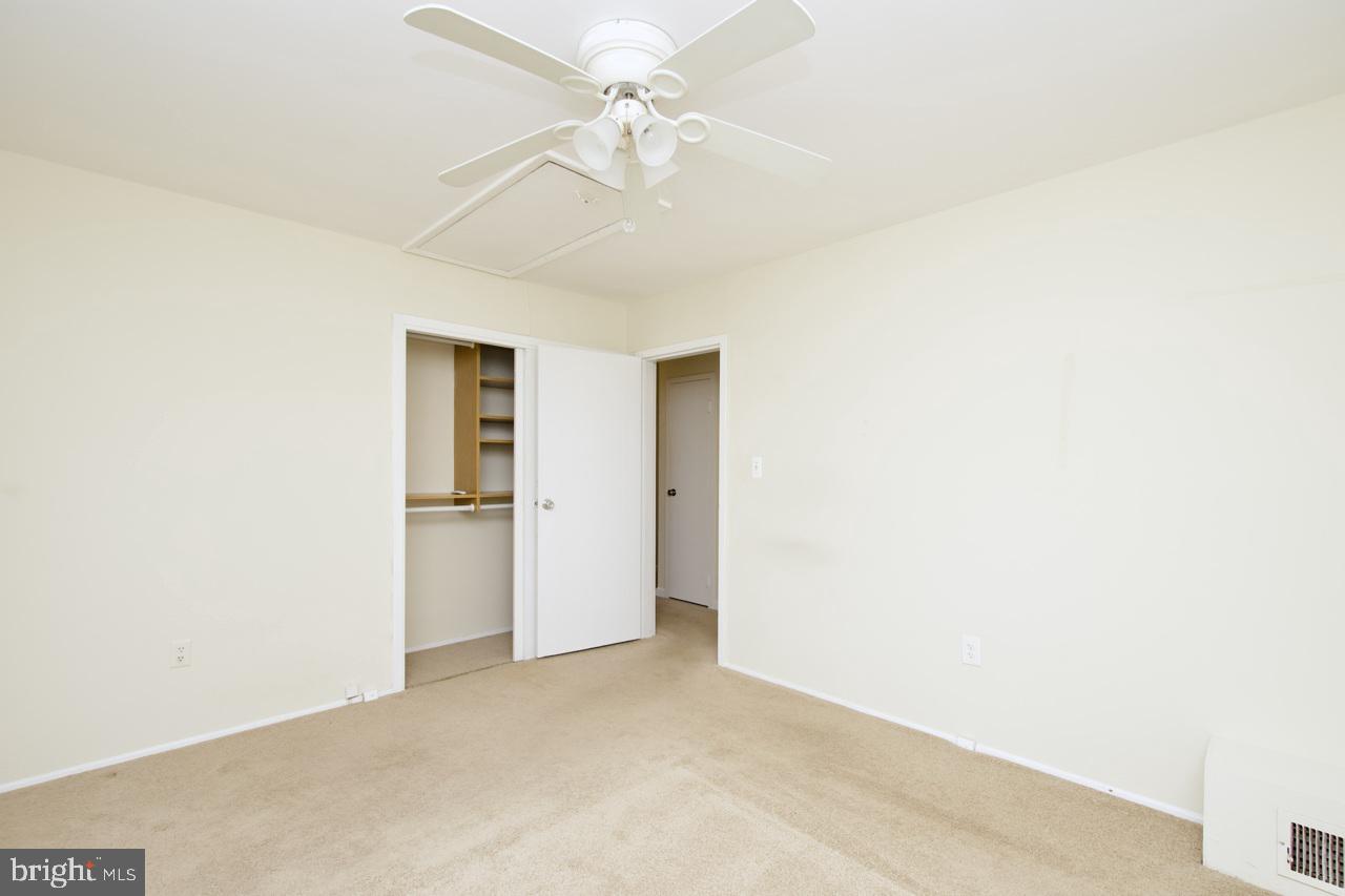 5509 Glenallen Street Springfield, VA 22151 - Photo 25 of 36 a view of a big room with closet and a ceiling fan