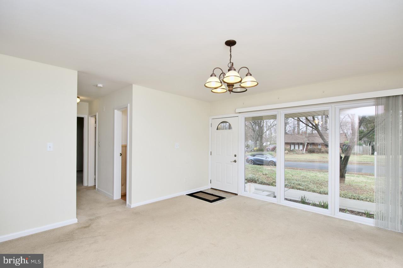 5509 Glenallen Street Springfield, VA 22151 - Photo 6 of 36 a view of an empty room with a window