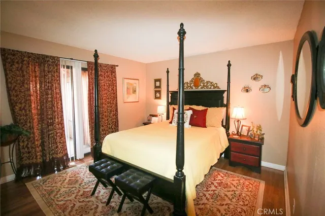 a bedroom with a bed and a mirror