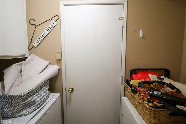 a dining room with furniture water view and a backyard