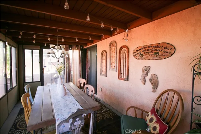 a view of a porch with potted plants