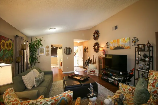 a kitchen with a stove a sink and a microwave