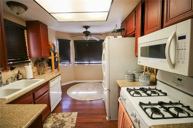 a white refrigerator freezer sitting inside of a kitchen