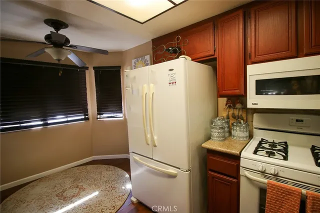 a bedroom with bed and cabinets