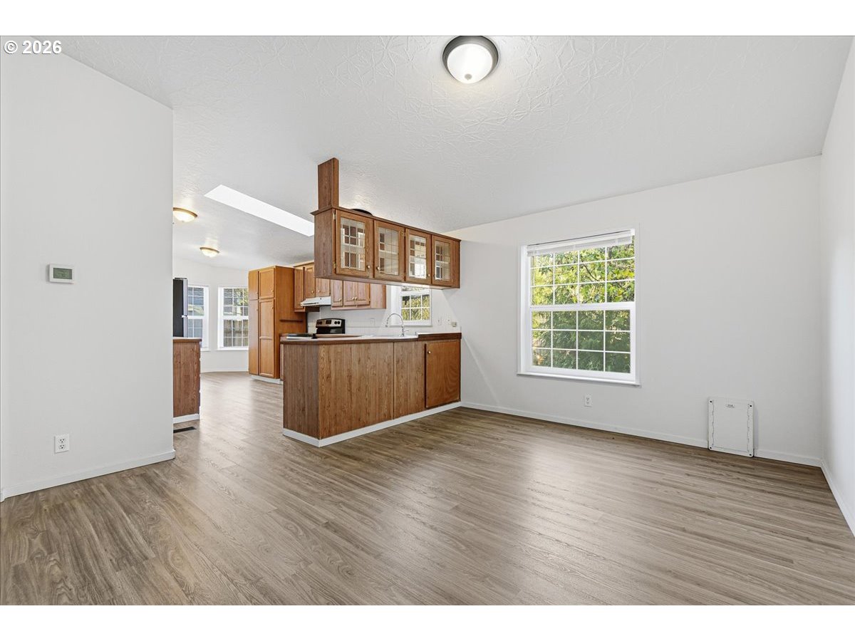 28 South Gee Creek Loop Ridgefield, WA 98642 - Photo 12 of 38 a view of kitchen with furniture and wooden floor