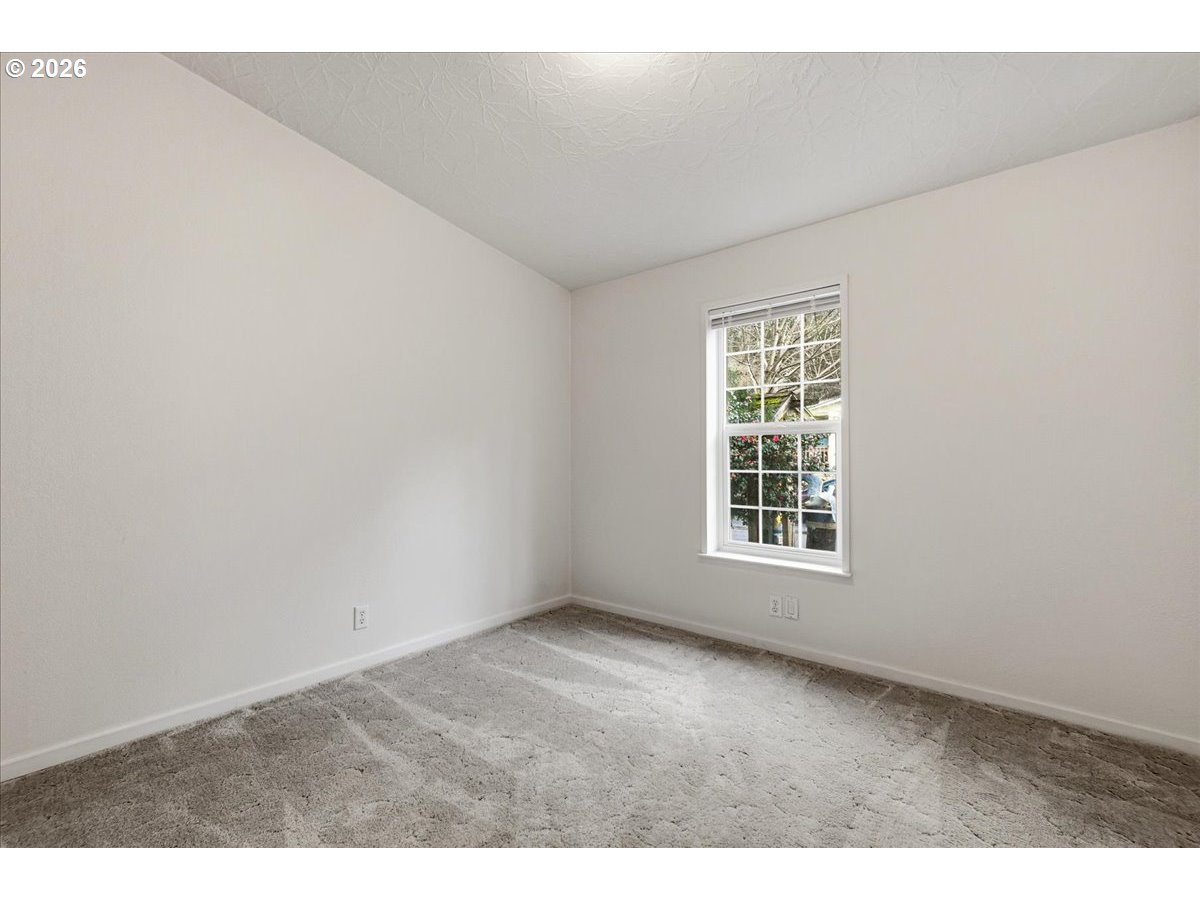 28 South Gee Creek Loop Ridgefield, WA 98642 - Photo 26 of 38 a view of an empty room with a window