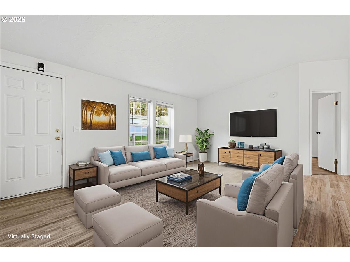 28 South Gee Creek Loop Ridgefield, WA 98642 - Photo 6 of 38 a living room with furniture and a flat screen tv