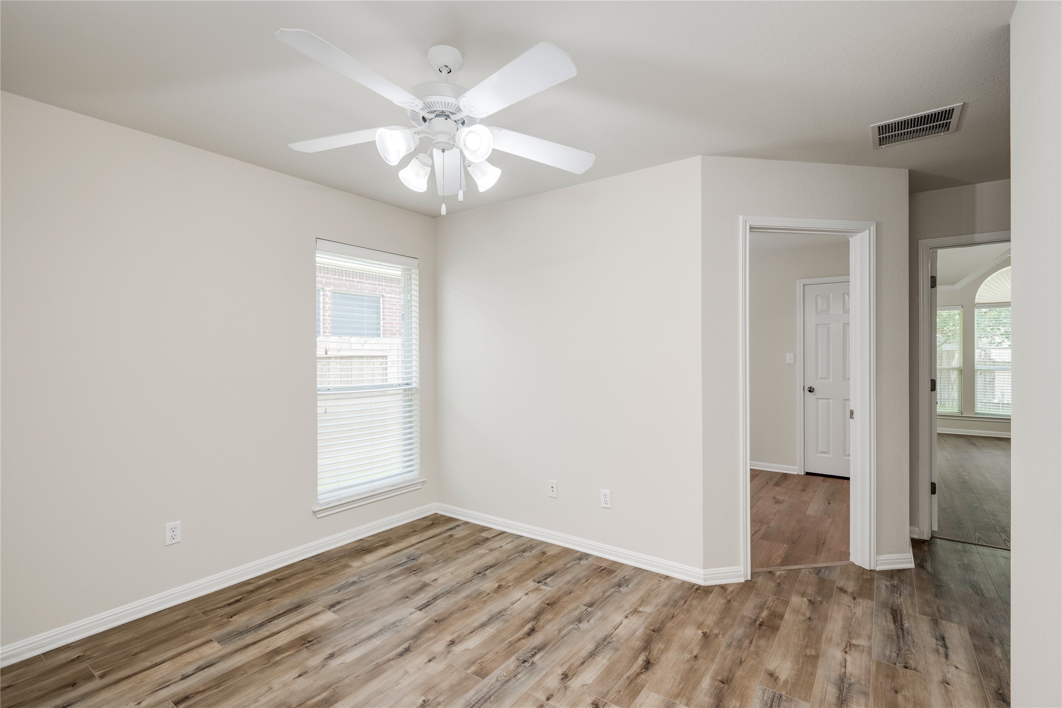 1813 Nelson Ranch Loop Cedar Park, TX 78613 - Photo 27 of 39 Well-lit room featuring durable wood flooring, offering versatility for various living needs.