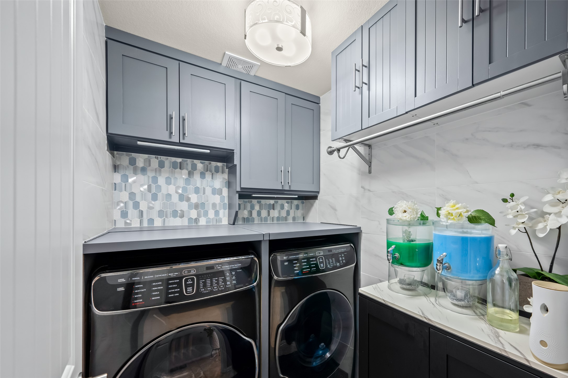 355 Evening Star Kyle, TX 78640 - Photo 16 of 21 a utility room with cabinets washer and dryer