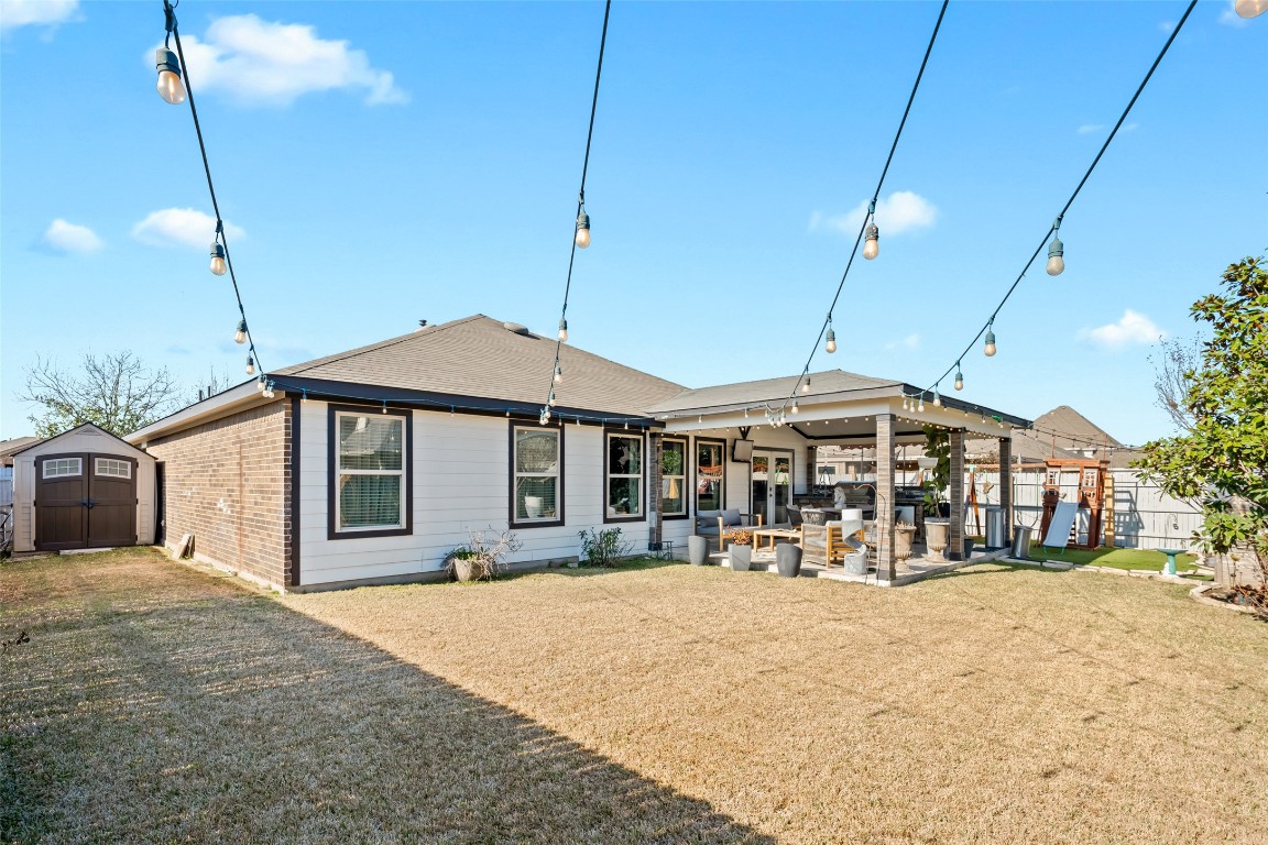 355 Evening Star Kyle, TX 78640 - Photo 21 of 21 The back view of the property featuries the patio area and yard space for all to enjoy.